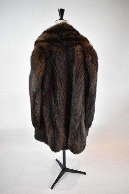 Lot 31 - A brown full length fur coat, size 38.