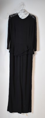 Lot 53 - ELIE SAAB; a black jumpsuit with black lace...