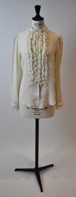 Lot 76 - DOLCE GABBANA; a cream 100% silk blouse with...