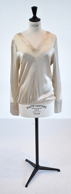 Lot 84 - CHRISTIES A PORTER; a beige 100% silk and...