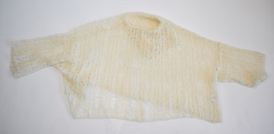 Lot 98 - A cream wool and mohair polo neck knitted...