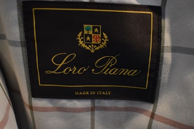 Lot 121 - LORO PIANA; a dark grey coat with padded...