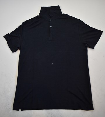 Lot 207 - LORO PIANA; a navy blue short sleeve polo...