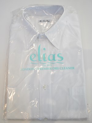 Lot 234 - LORO PIANA; a white cotton long sleeve shirt,...