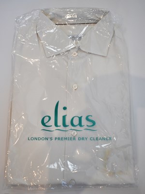 Lot 237 - LORO PIANA; a cream cotton long sleeve shirt,...