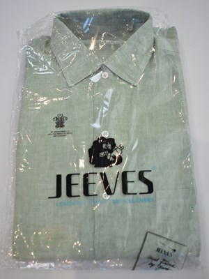 Lot 254 - LORO PIANA; a light green linen long sleeve...