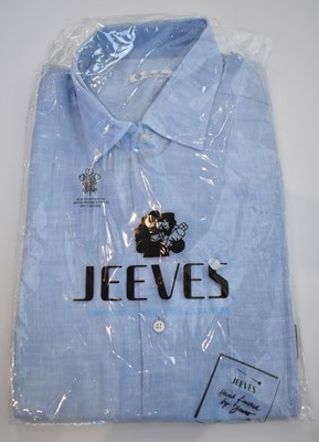 Lot 255 - LORO PIANA; a light blue linen long sleeve...