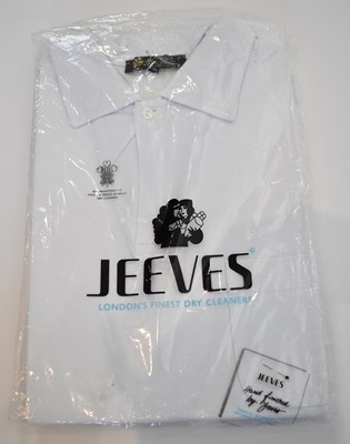 Lot 264 - LORO PIANA; a white cotton short sleeve polo...