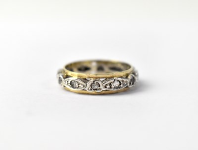 Lot 1026 - A 9ct gold band ring with a central band of illusion set small white stones