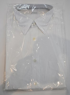 Lot 319 - BRUNELLO CUCINELLI; a white linen long sleeve...