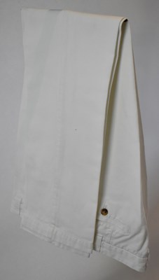 Lot 343 - LORO PIANA; a pair of white cotton trousers,...