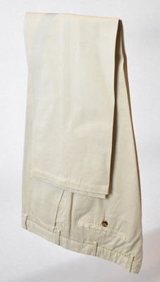 Lot 352 - LORO PIANA; a pair of beige cotton trousers,...