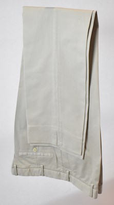 Lot 353 - LORO PIANA; a pair of beige cotton trousers,...