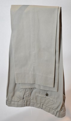 Lot 356 - LORO PIANA; a pair of beige cotton trousers,...