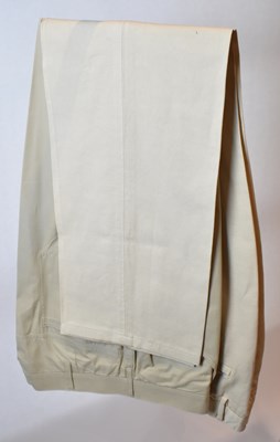 Lot 359 - LORO PIANA; a pair of beige cotton trousers,...