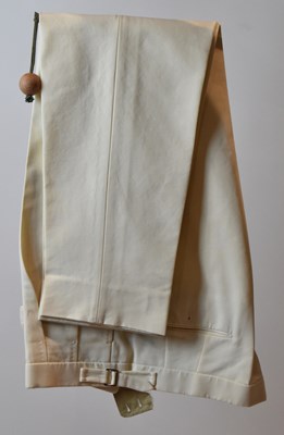 Lot 372 - LORO PIANA; a pair of beige cotton trousers,...