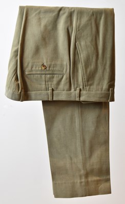 Lot 382 - LORO PIANA; a pair of beige cotton trousers,...