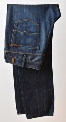 Lot 394 - FOR ALL MANKIND; a pair of indigo denim cotton...