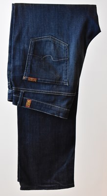 Lot 395 - FOR ALL MANKIND; a pair of indigo blue...