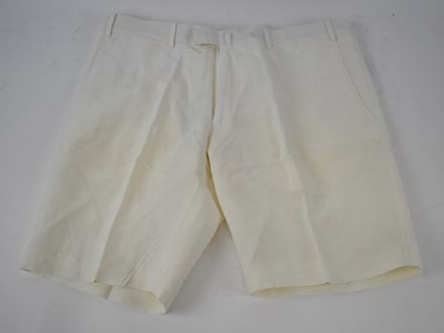 Lot 407 - BERNARD ZINS; A pair of cream cotton shorts,...