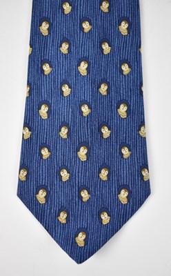 Lot 436 - HERMES; a 100% silk blue tie with owl design.