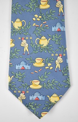 Lot 438 - HERMES; a 100% silk blue tie with teapot design.