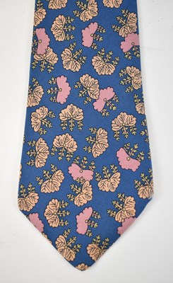 Lot 441 - HERMES; a 100% silk blue tie with pink floral...