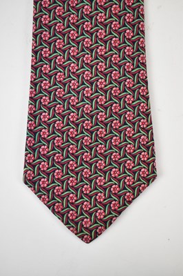 Lot 443 - HERMES; a 100% silk blue tie with pink and...