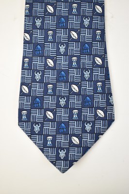 Lot 445 - HERMES; a 100% silk blue tie with drum and...