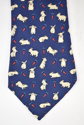 Lot 446 - HERMES; a 100% silk blue tie with rabbit and...