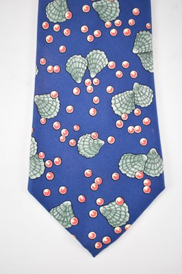 Lot 448 - HERMES; a 100% silk blue tie with green shell...