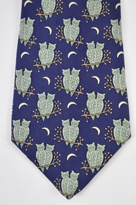 Lot 455 - HERMES; a 100% silk blue tie with owl design.