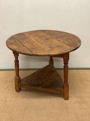 Lot 584 - A pine cricket table, height 61cm, width 79cm