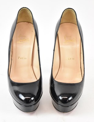 Lot 522 - LOUBOUTIN; a pair of black patent platform...