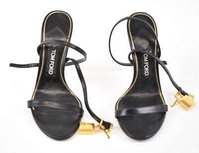 Lot 528 - TOM FORD; a pair of black leather strappy...