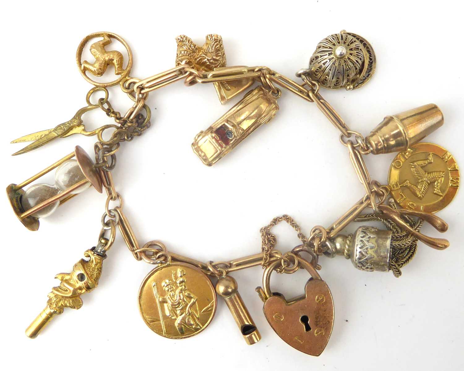 Lot 921 - A vintage 9ct gold charm bracelet