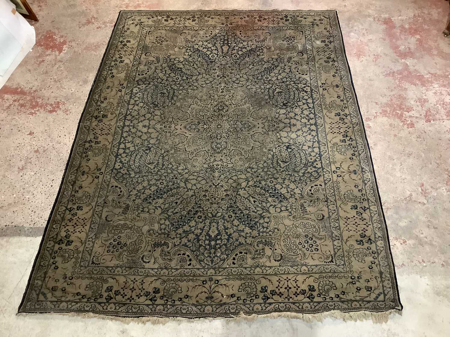 Lot 6474 - A blue ground Eastern style rug with floral