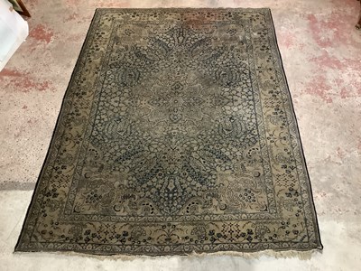 Lot 185 - A blue ground Eastern style rug with floral...