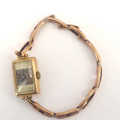 Lot 1130 - A vintage ladies' 9ct gold crown wind tank watch