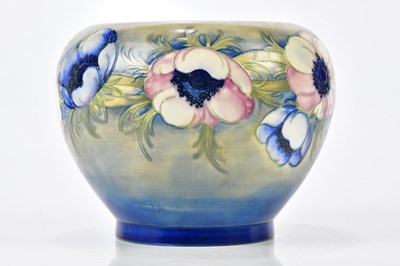 Lot 109 - WALTER MOORCROFT; a jardinière decorated in...