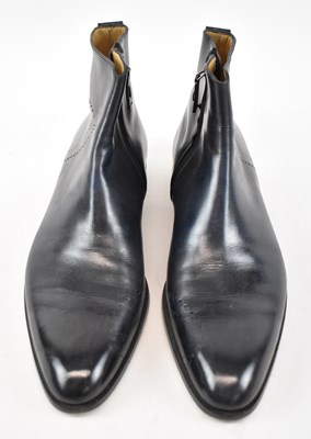 Lot 554 - BERLUTI; a pair of black leather zip-up ankle...