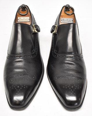 Lot 565 - A pair of black leather shoes, size 10.