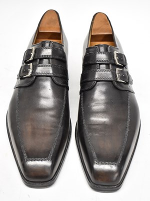 Lot 567 - BERLUTI; a pair of black leather shoes with...