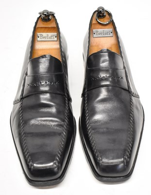 Lot 569 - A pair of black leather shoes, size 9.5.