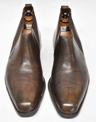 Lot 573 - BERLUTI; a pair of brown leather ankle boots,...