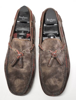 Lot 579 - BERLUTI; a pair of brown suede loafers with...