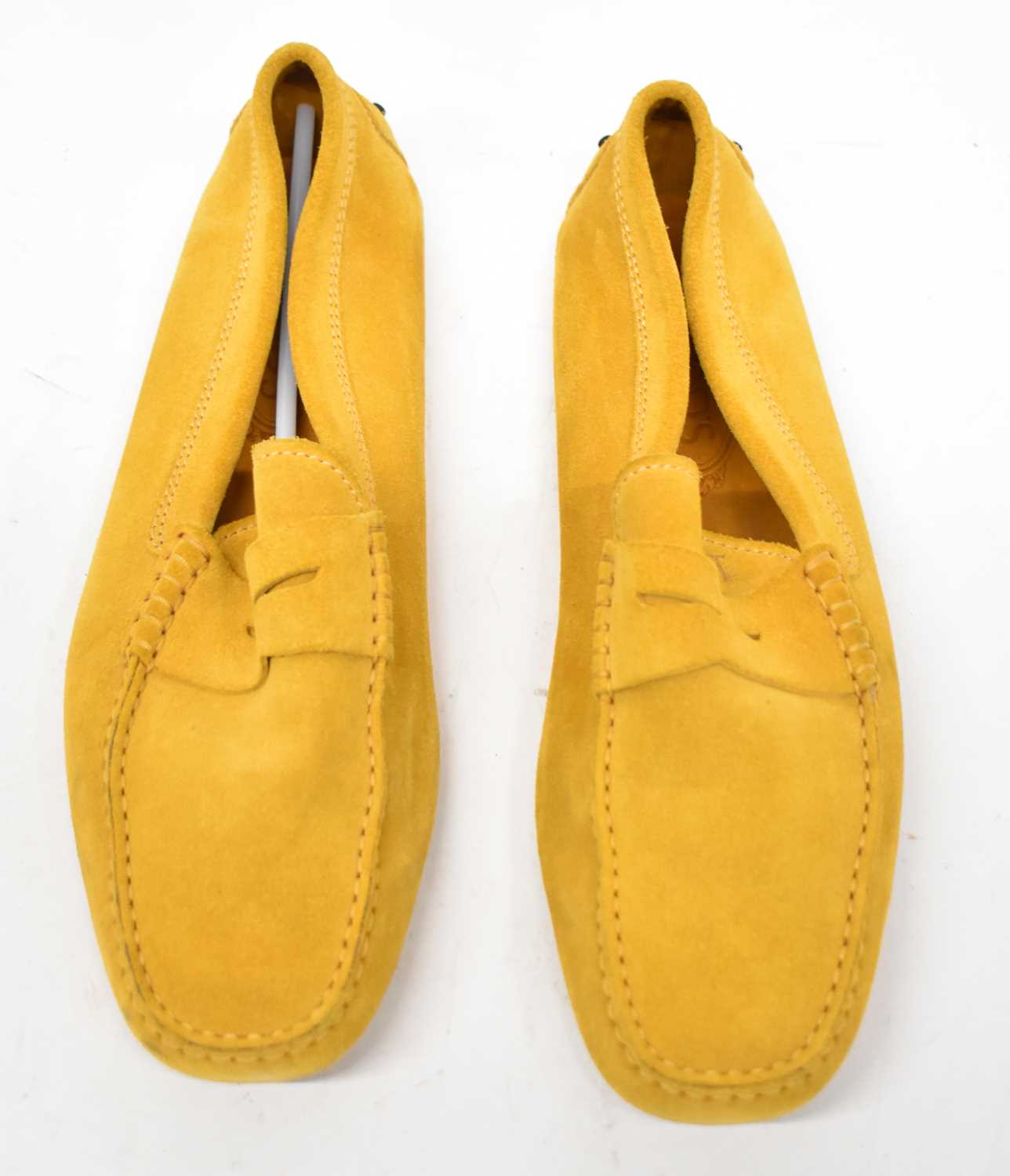 Lot 584 - TODS: a pair yellow suede loafers, size 9.5.