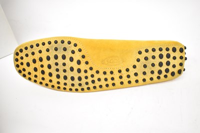 Lot 584 - TODS: a pair yellow suede loafers, size 9.5.