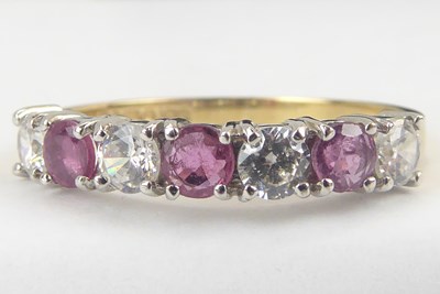 Lot 1036 - A 9ct gold ring set with three small claw set sapphires
