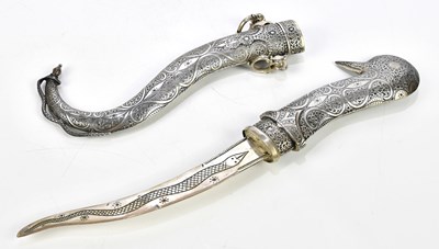 Lot 448 - An Eastern white metal dagger, 32cm.